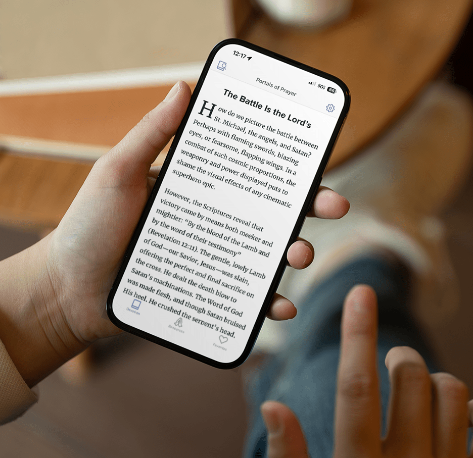 Person on phone reading devotion